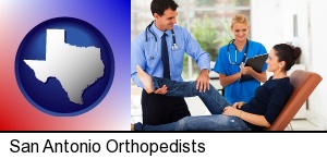 San Antonio, Texas - an orthopedist examining a patient
